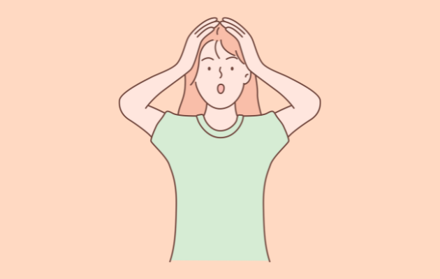 頭を抱える女性